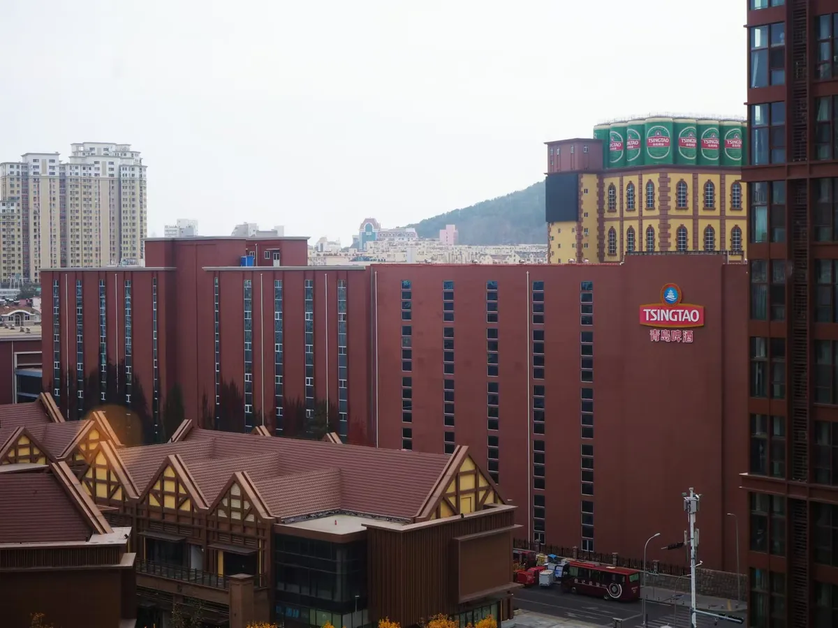 The exterior of the Tsingtao Beer Museum with giant fiberglass beer cans on the roofline
