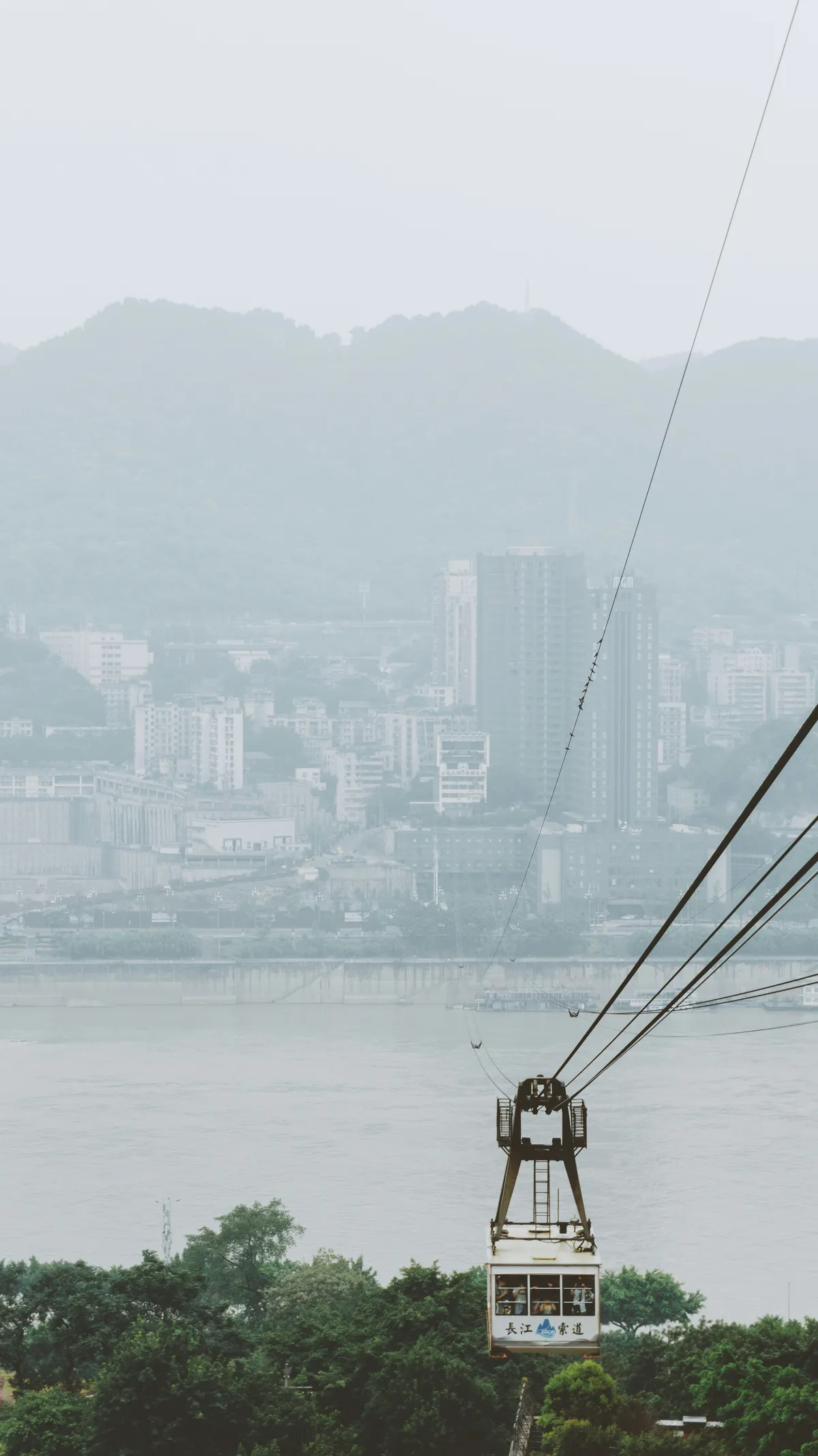 The Yangtze River cableway car crossing high above the water in Chongqing