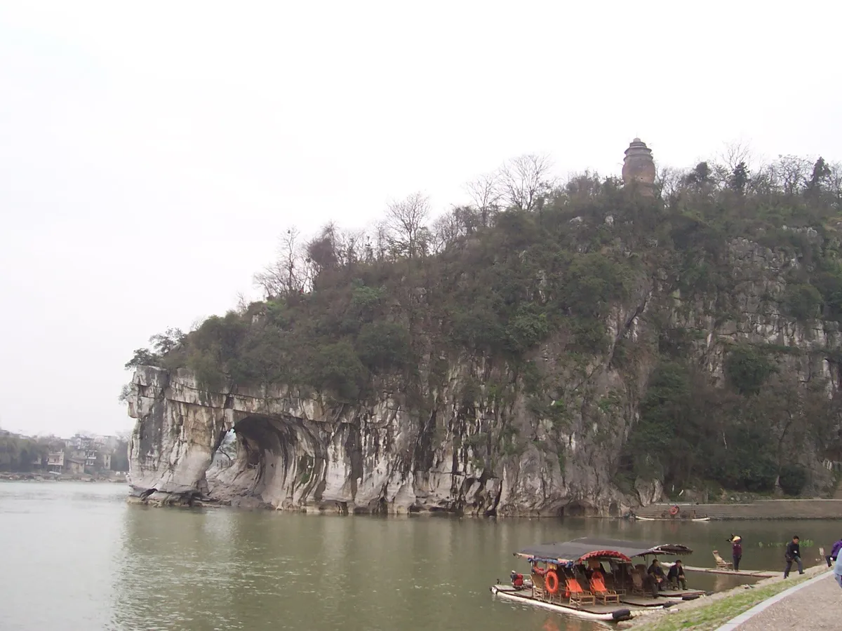 Elephant Trunk Hill's arch resembling an elephant drinking from the river, with a pagoda on top