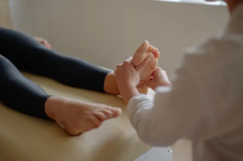 A foot massage in progress at a traditional Chinese tuina spa