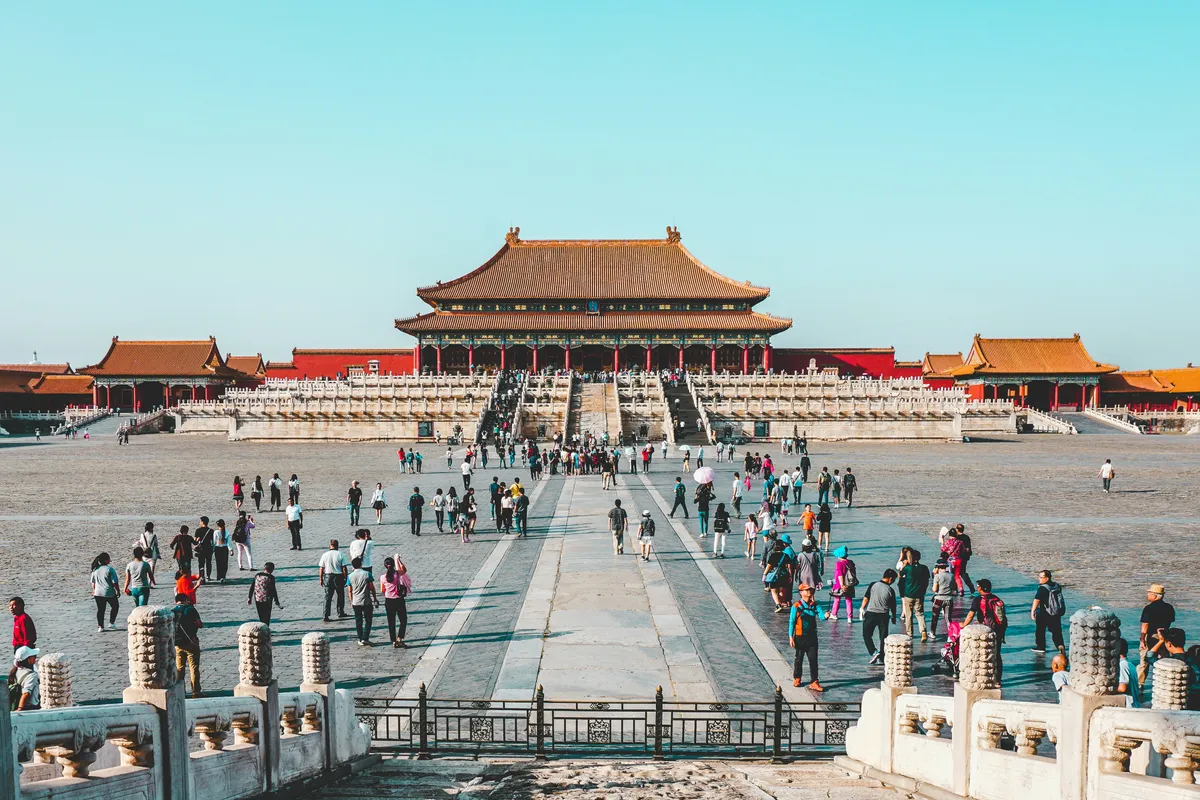 Crowds crossing the vast main courtyard of the Forbidden City in Beijing