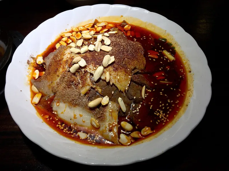 Thin-sliced beef and offal fuqi feipian tossed in chili oil and peanuts