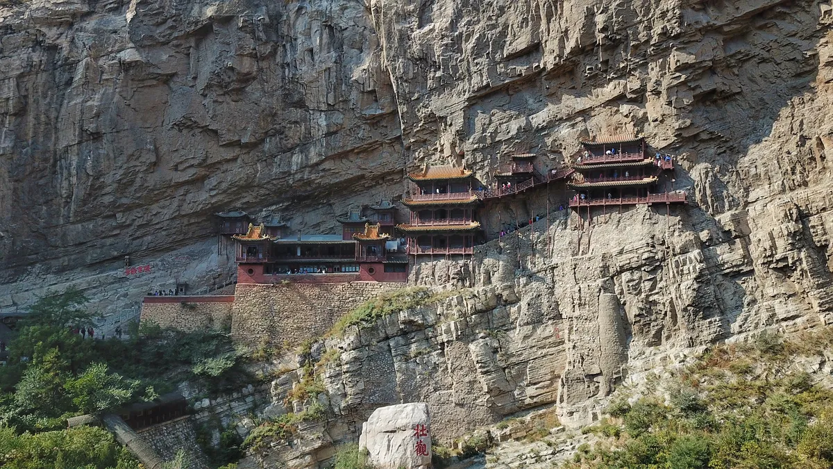 The wooden halls of the Hanging Temple bolted into a sheer cliff face on Mount Heng