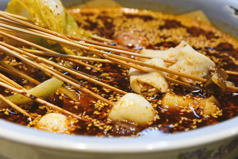 A serving of cooked hotpot ingredients in a bowl