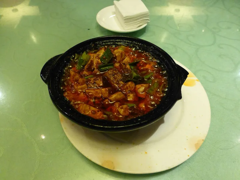 Mapo tofu served in a black clay pot at a Chengdu restaurant