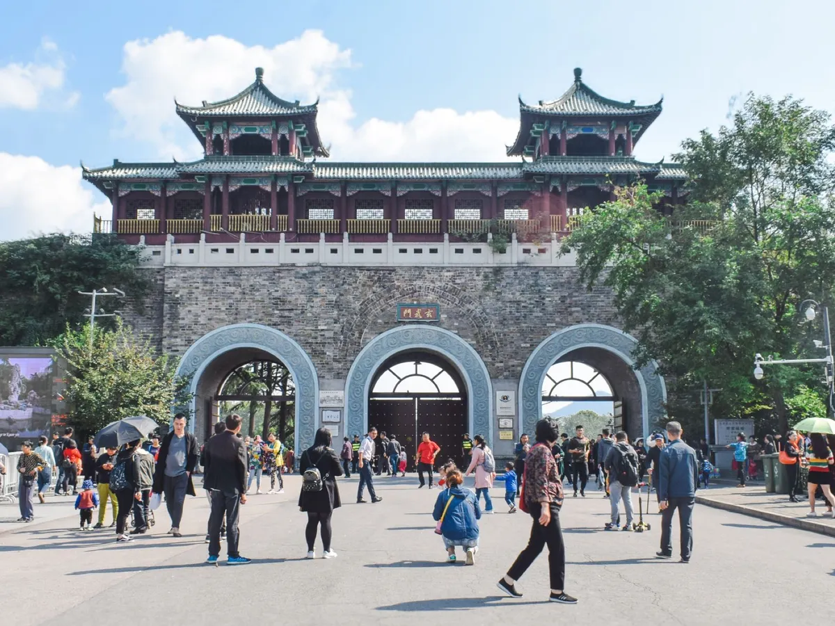 Visitors passing through the arched stone gate of Xuanwu Gate on Nanjing's Ming City Wall