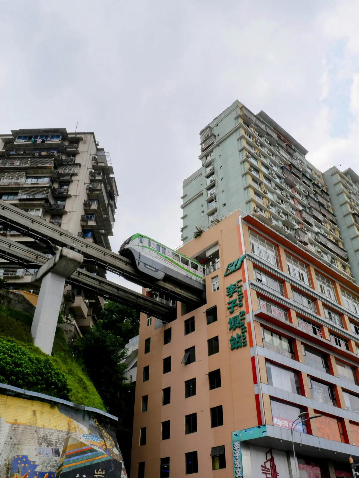 Chongqing's light-rail monorail passing through a residential apartment building
