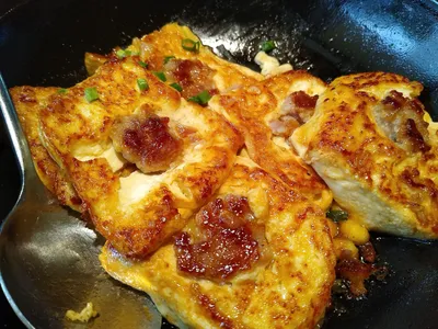 Golden pan-fried tofu pieces stuffed with minced meat, a Guangxi niang doufu dish