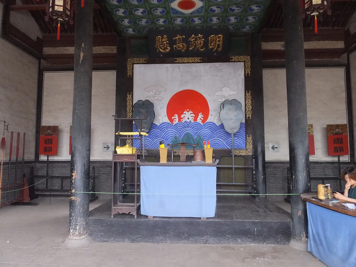 The 'Bright Mirror Hanging High' court hall inside Pingyao County Yamen, set up for a staged hearing