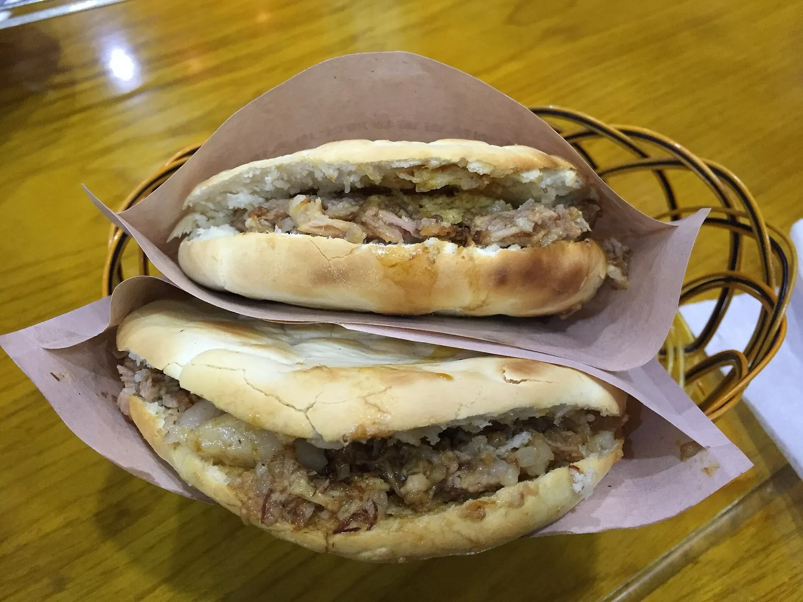 A roujiamo sandwich stuffed with chopped braised pork