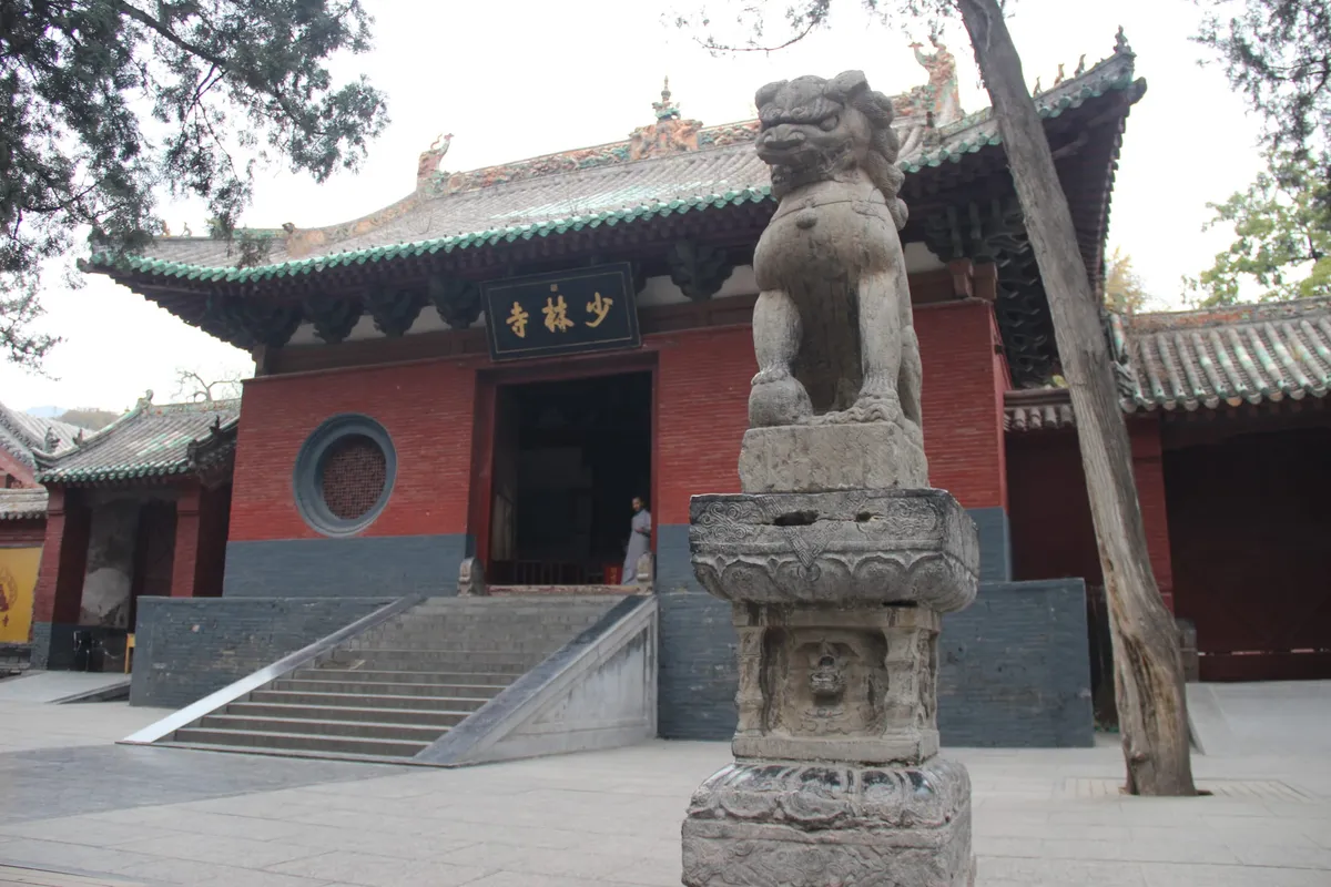 The main gate of Shaolin Temple with a stone lion guardian in front