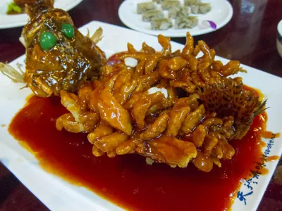 A whole squirrel-cut mandarin fish fried and glazed in red sweet-and-sour sauce