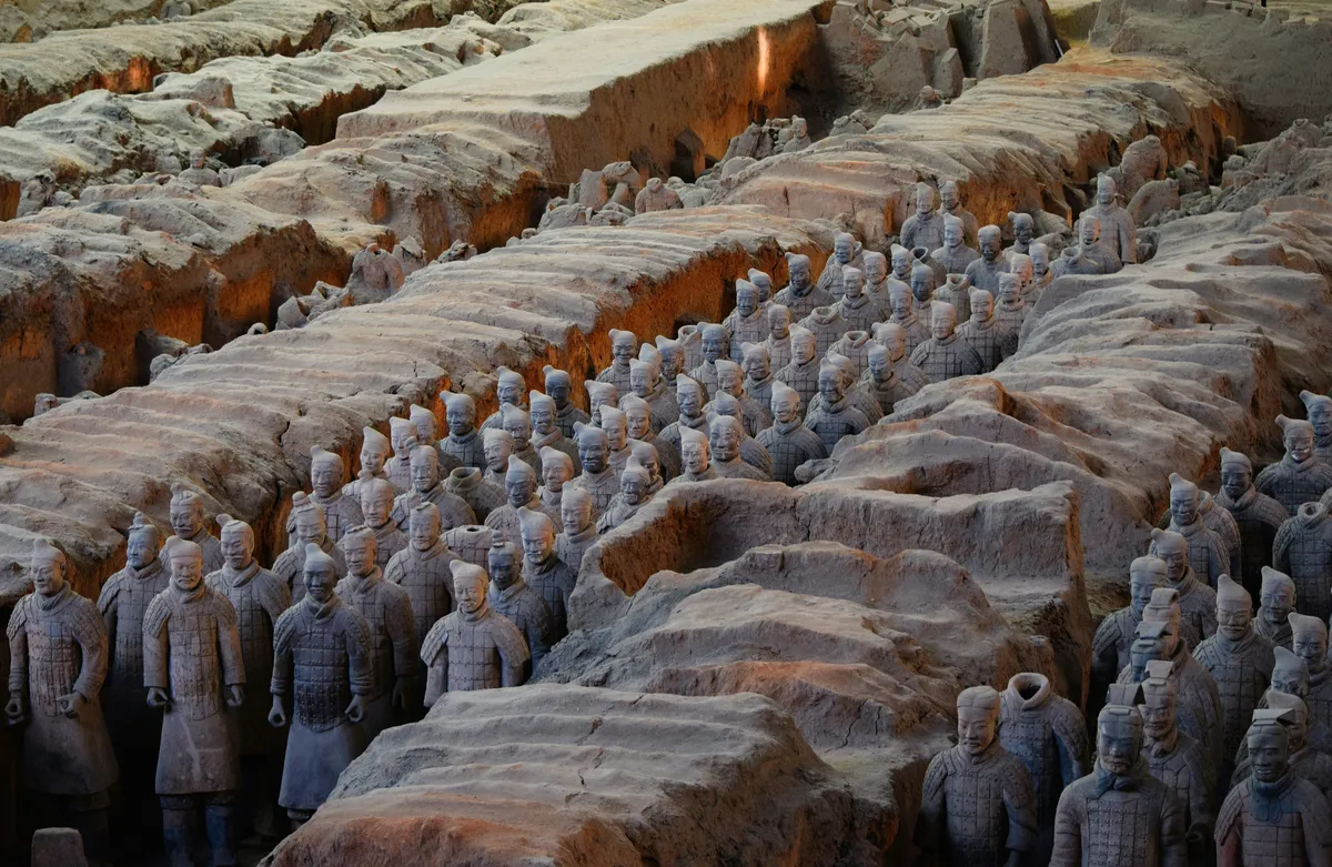 Rows of individually detailed Terracotta Army soldiers in an excavation pit near Xi'an