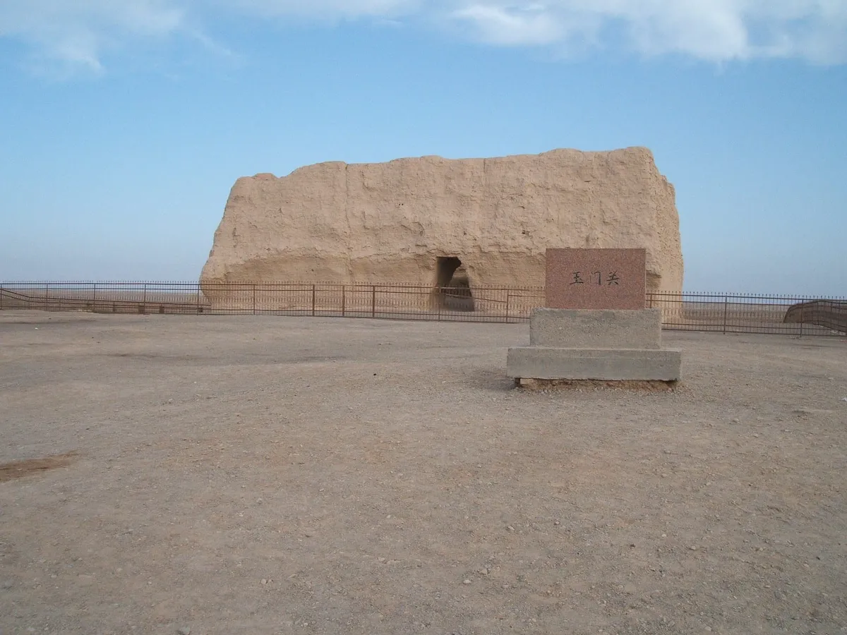 The lone rammed-earth watchtower of Yumen Pass standing in open desert